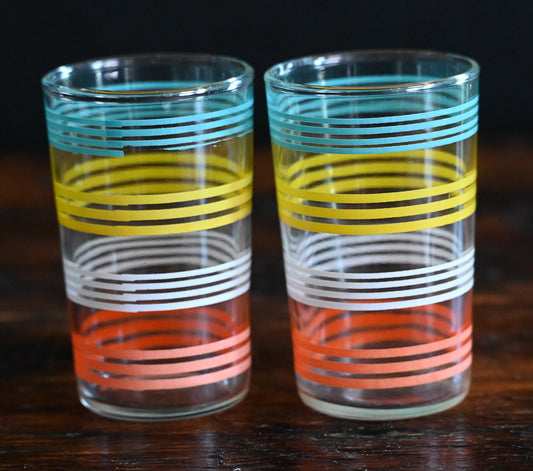 blue, yellow, white and orange striped juice glasses