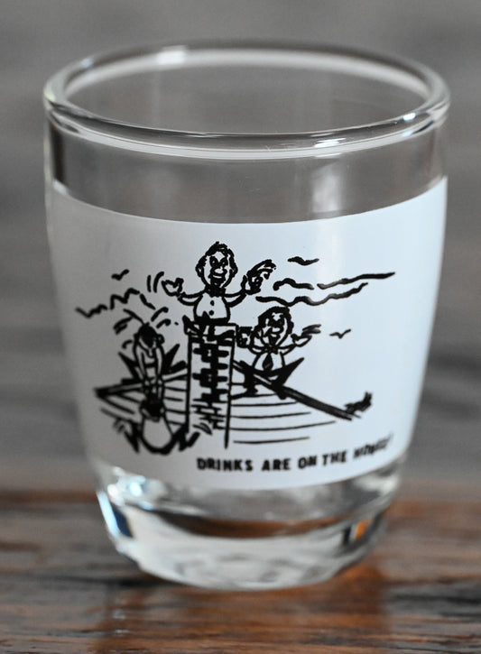 black and white print "Drinks are on the House" shot glass