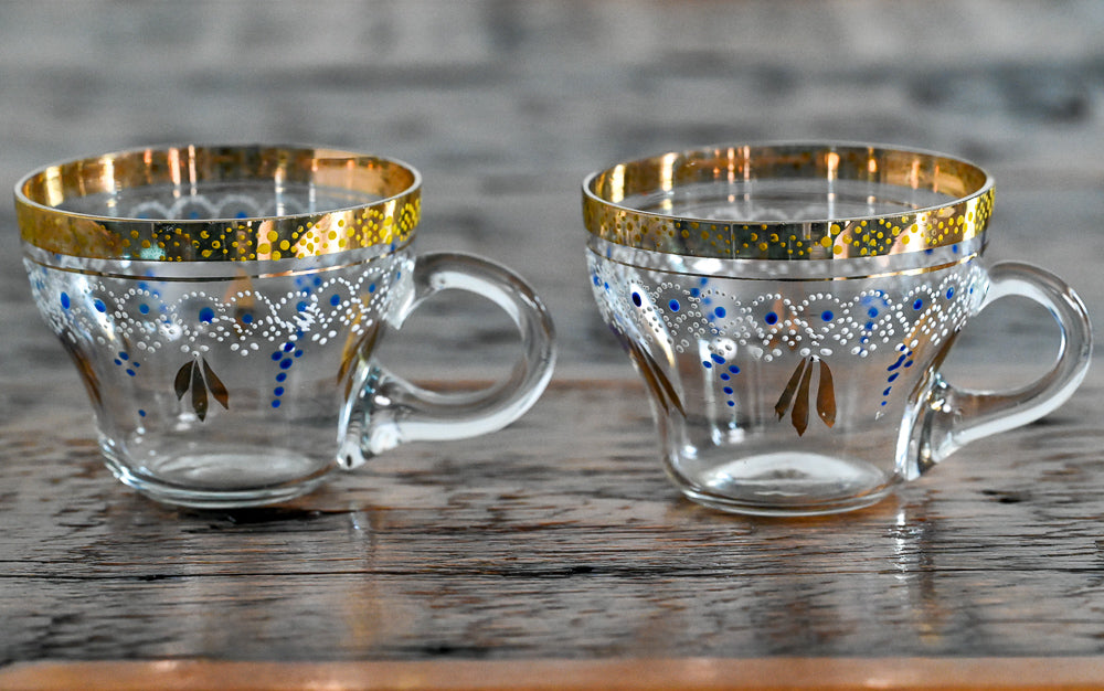clear punch cups with gold rim, white and blue painted pattern