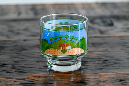 Sango glass printed with farm scene on wood table
