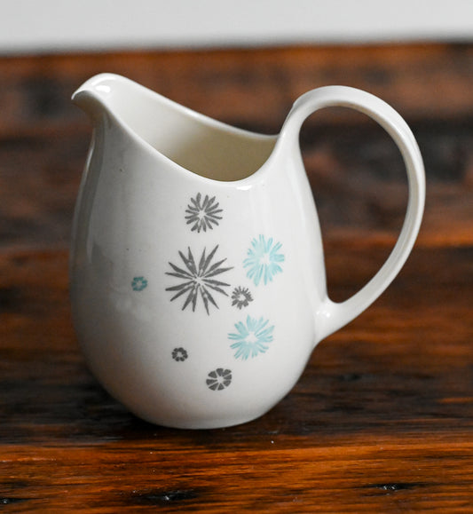 cream pitcher with gray and light blue stars print