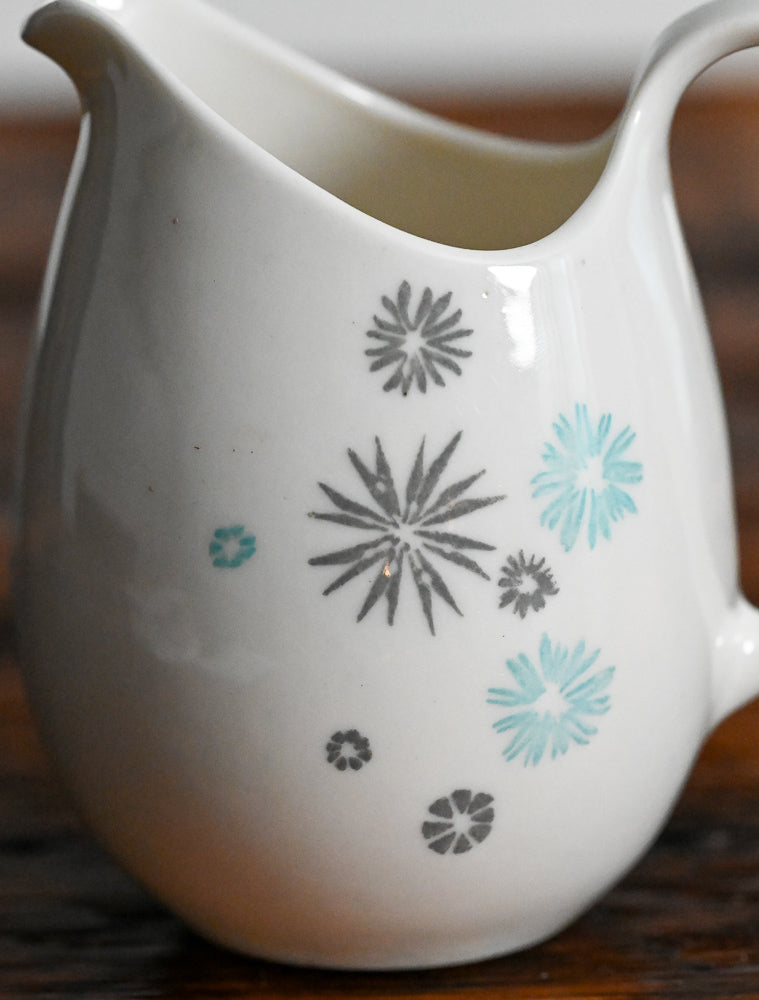 cream pitcher with gray and light blue stars print