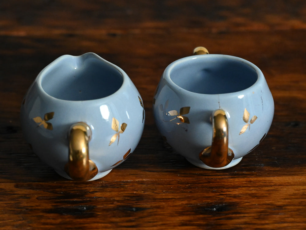 blue blue and gold leaf sugar and creamer set with gold handles