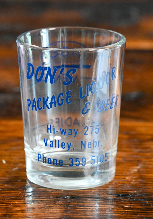 Don's package liquor shotglass, blue writing, from Valley, Nebraska