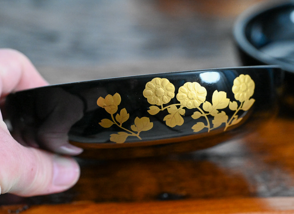 black bowls with gold flowers design 