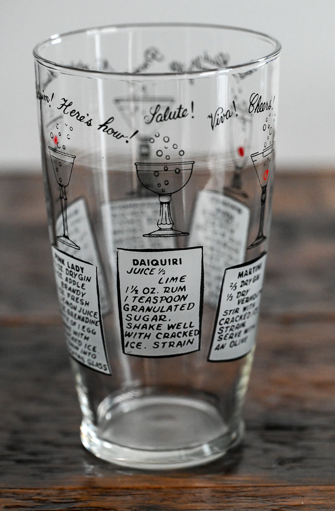 Anchor Hocking mixing glass with cocktail recipes on it