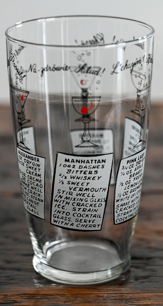 Anchor Hocking mixing glass with cocktail recipes on it