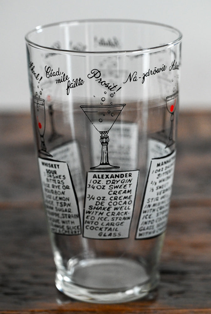 Anchor Hocking mixing glass with cocktail recipes on it