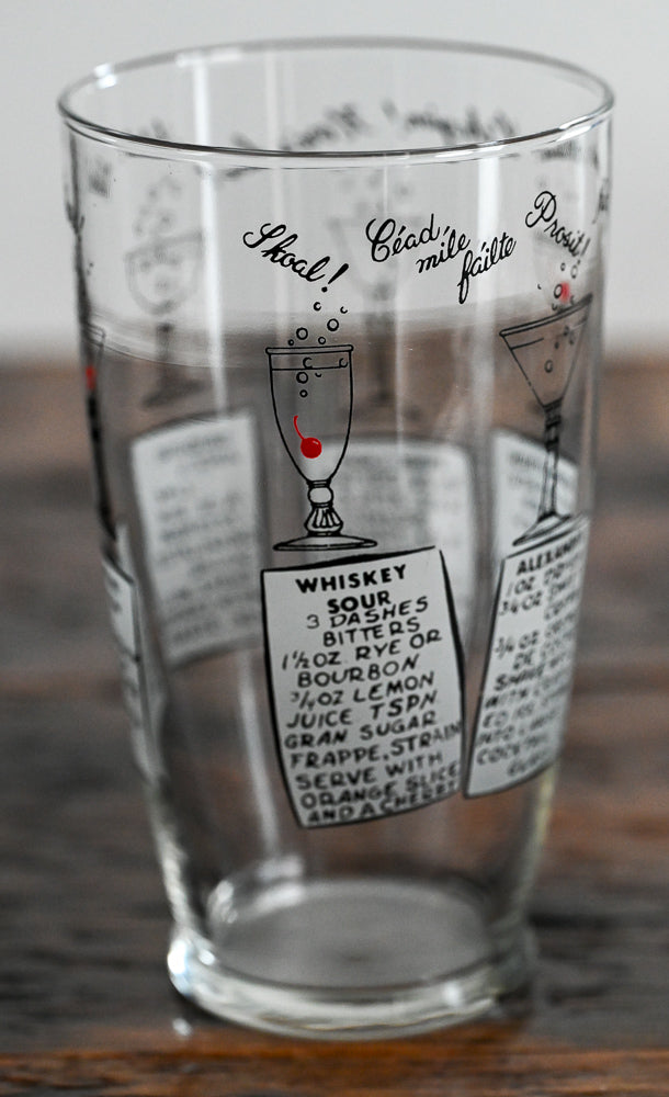 Anchor Hocking mixing glass with cocktail recipes on it