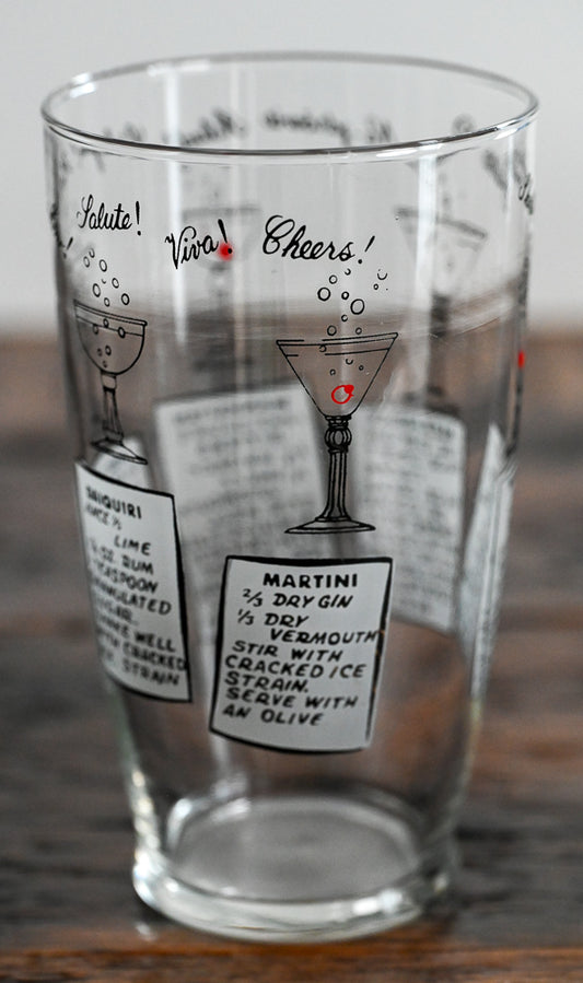 Anchor Hocking mixing glass with cocktail recipes on it