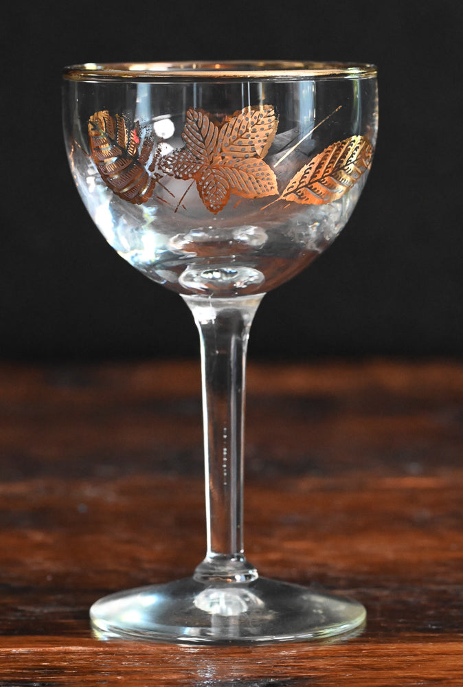 gold leaf and gold rim cocktail coupes