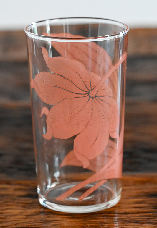 pink floral print tumbler on wood table