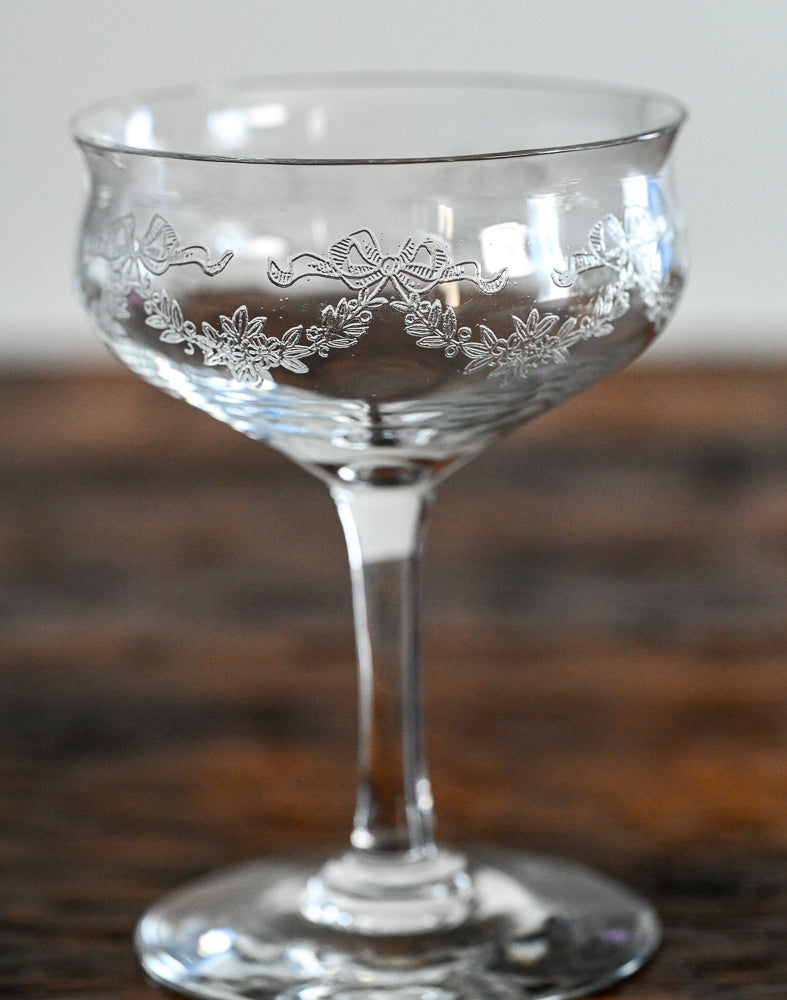 bow and flower etched cocktail coupes