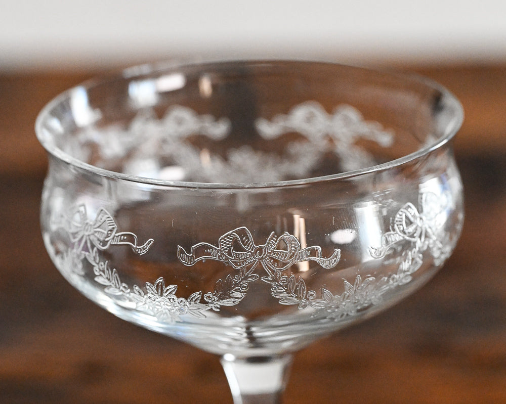 bow and flower etched cocktail coupes