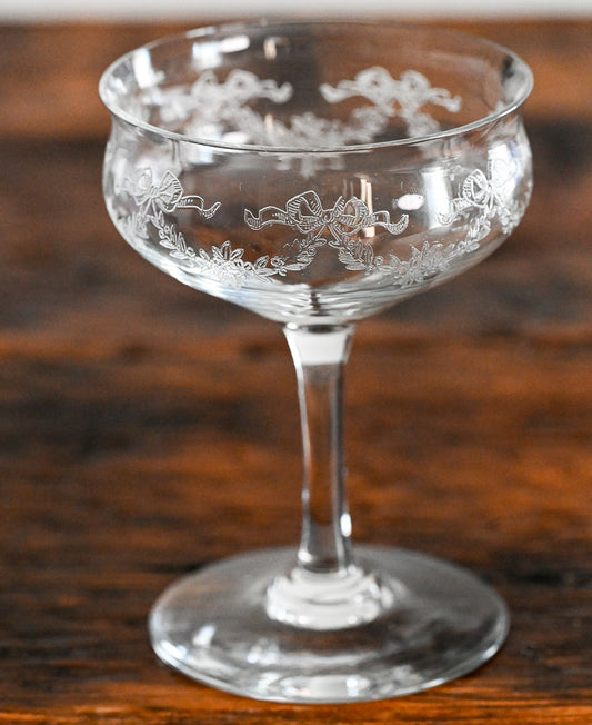 bow and flower etched cocktail coupes