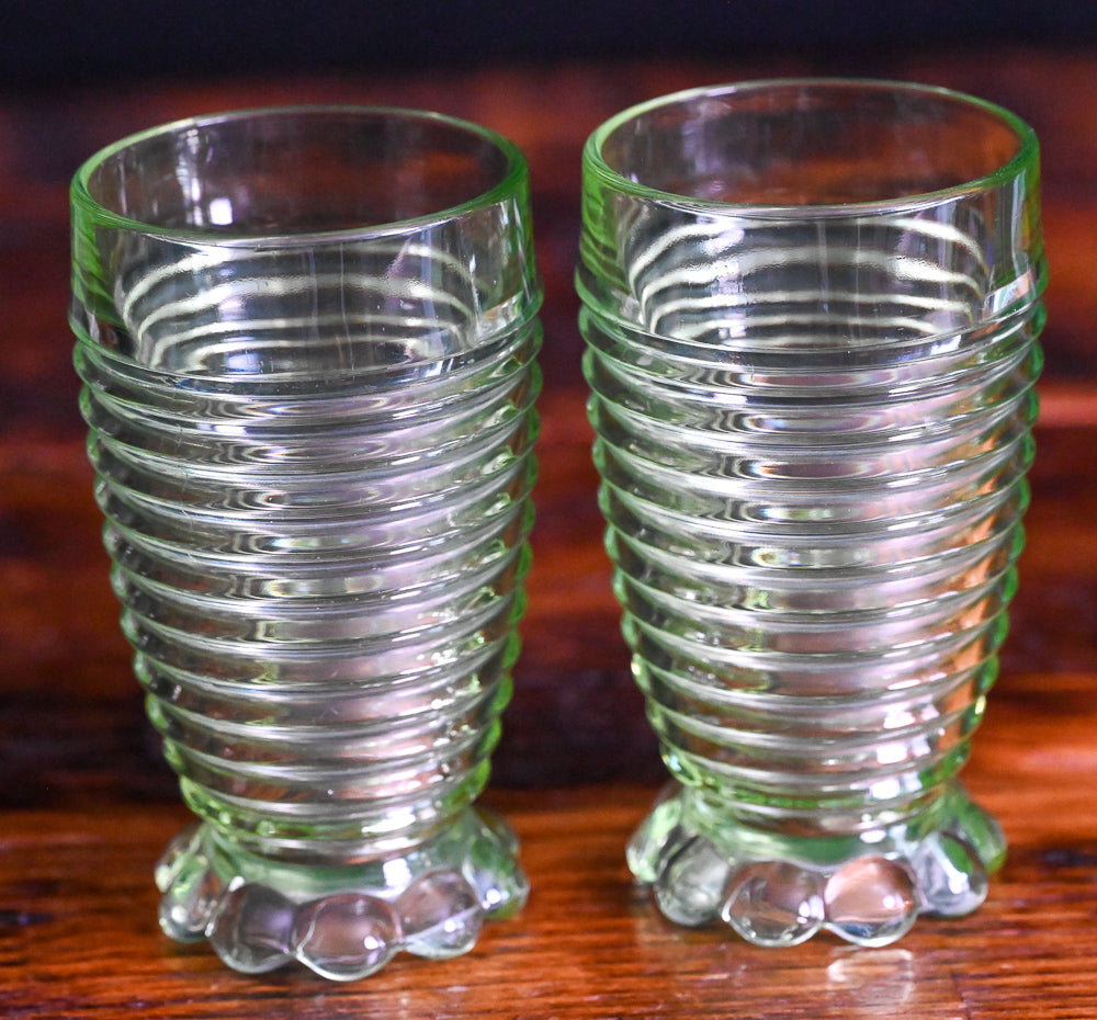light green Uranium Anchor Hocking Manhattan footed tumblers