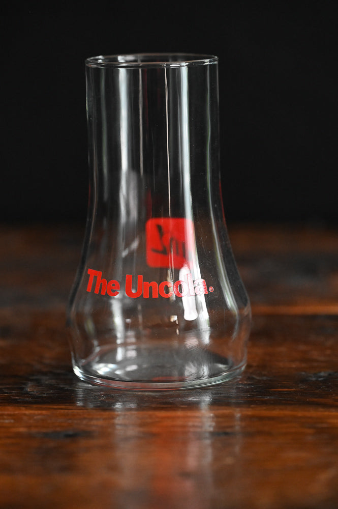7-Up the Uncola glass, red print on upside down glass