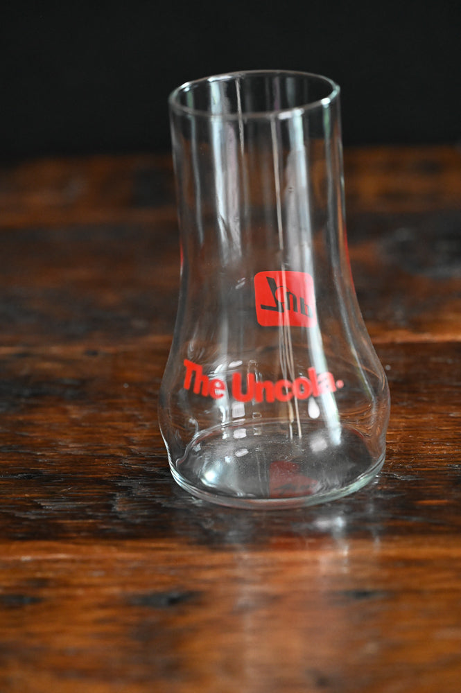 7-Up the Uncola glass, red print on upside down glass