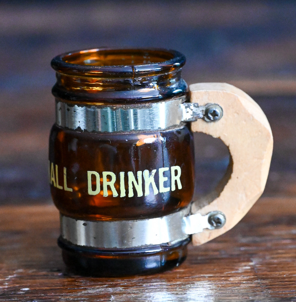 brown glass mug shotglass with wooden handle, says "small drinker"