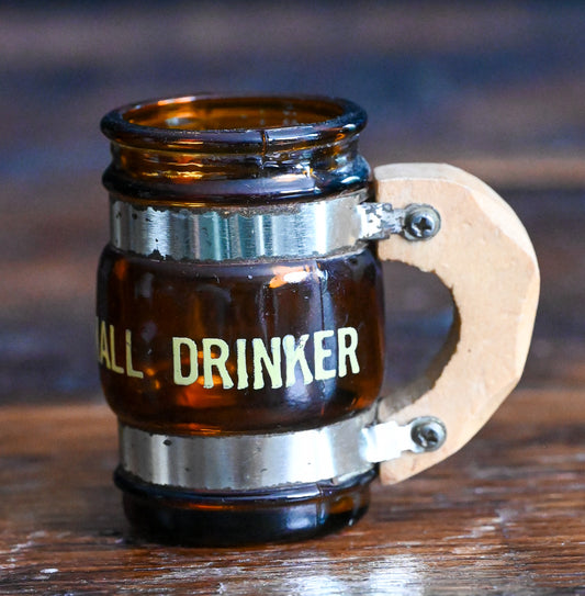 brown glass mug shotglass with wooden handle, says "small drinker"