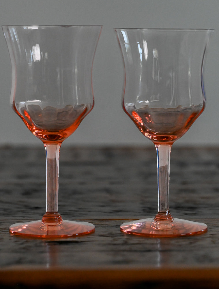 pink goblets on wood table