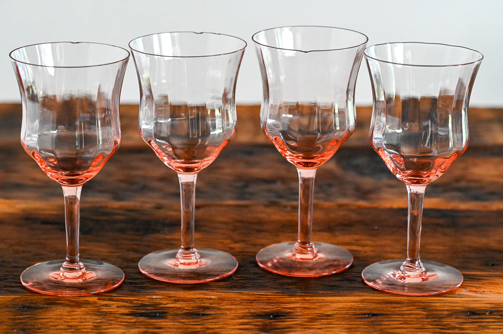 pink goblets on wood table