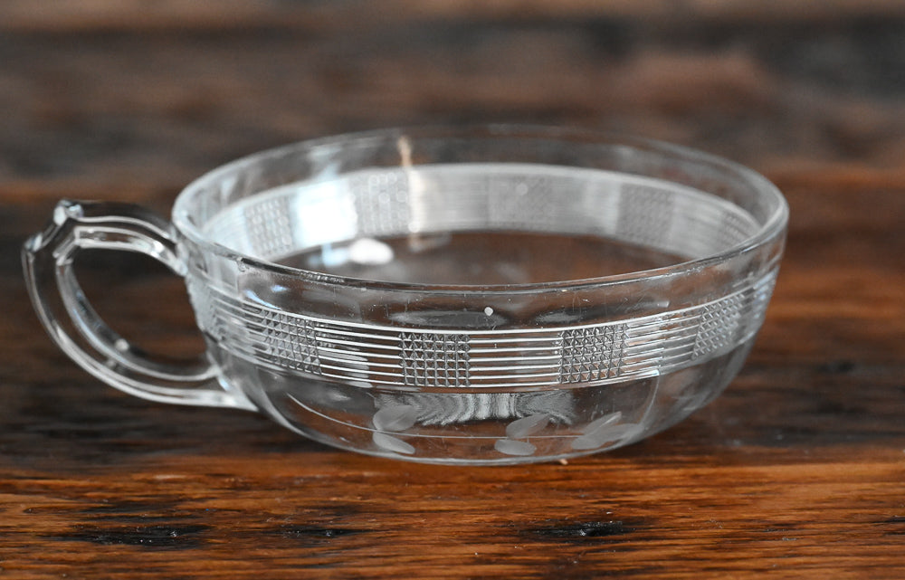 etched lines on sides of shallow bowl with handle