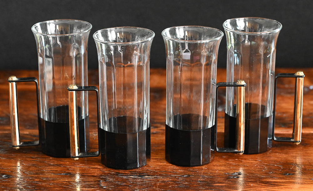 glass tumblers with black metal and brass handles