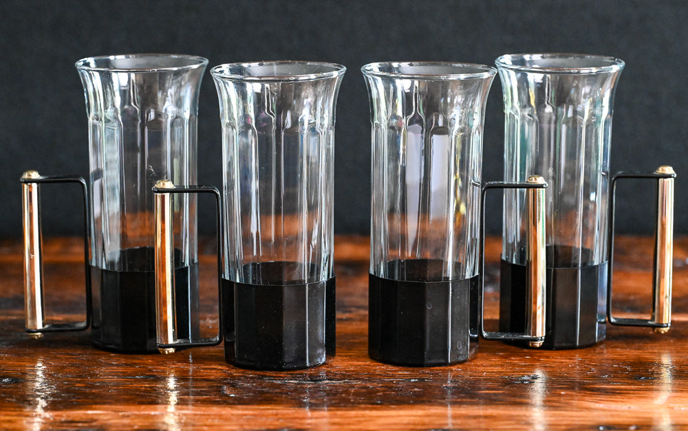 glass tumblers with black metal and brass handles