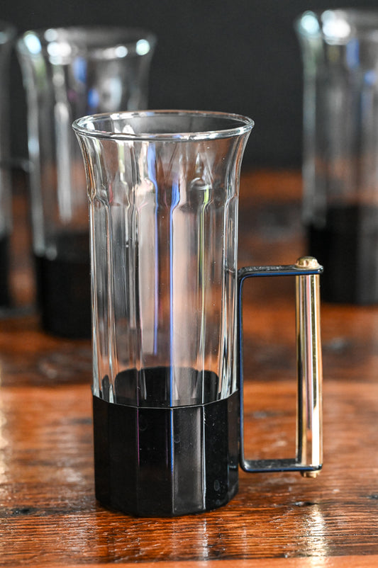 glass tumblers with black metal and brass handles