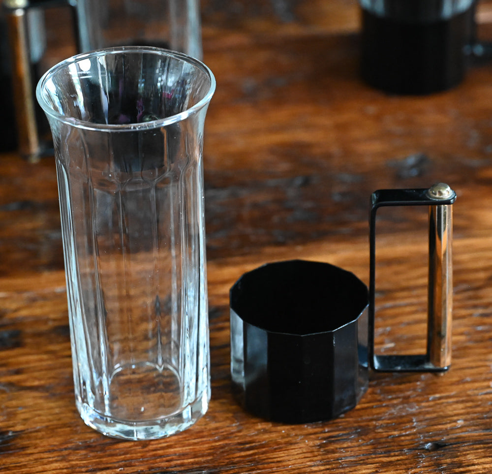 glass tumblers with black metal and brass handles