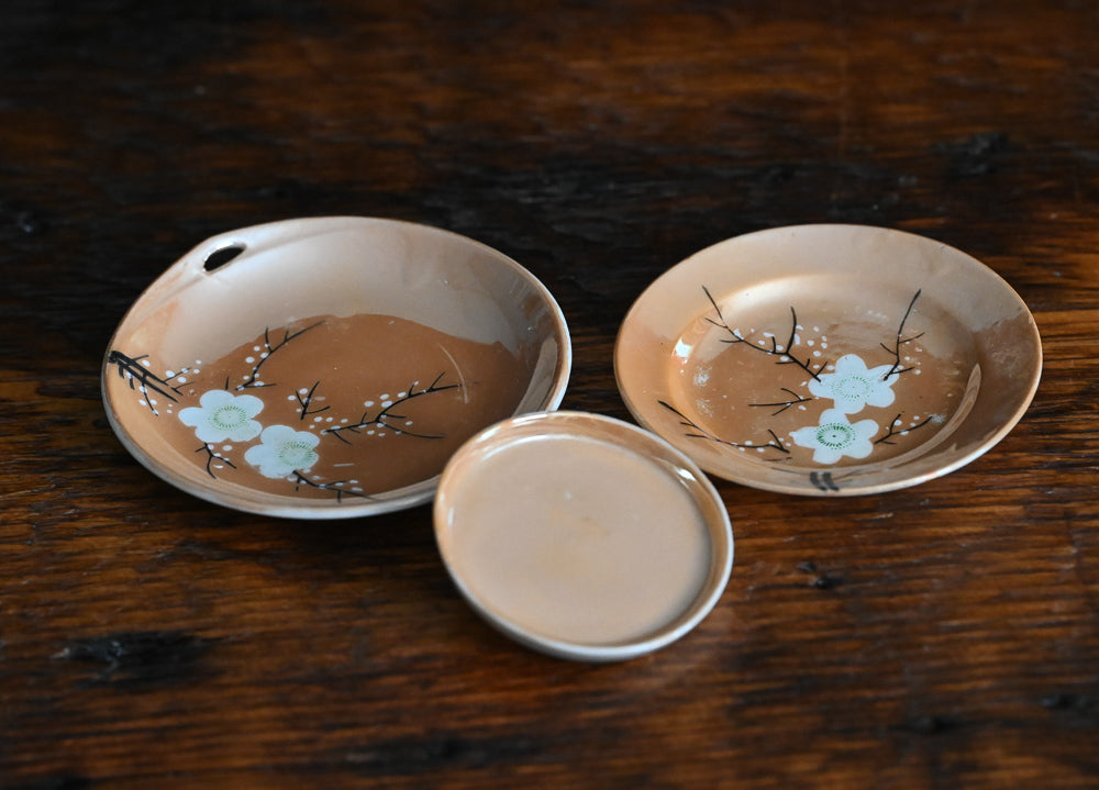 peach colored Japanese lusterware trinket dishes with white painted flowers