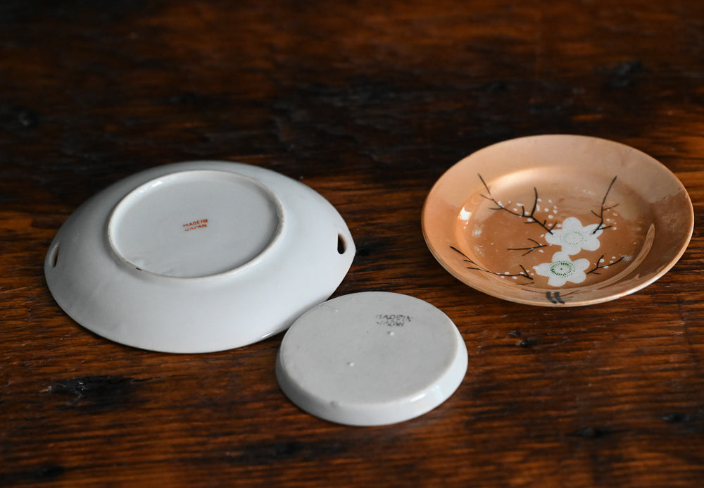 peach colored Japanese lusterware trinket dishes with white painted flowers