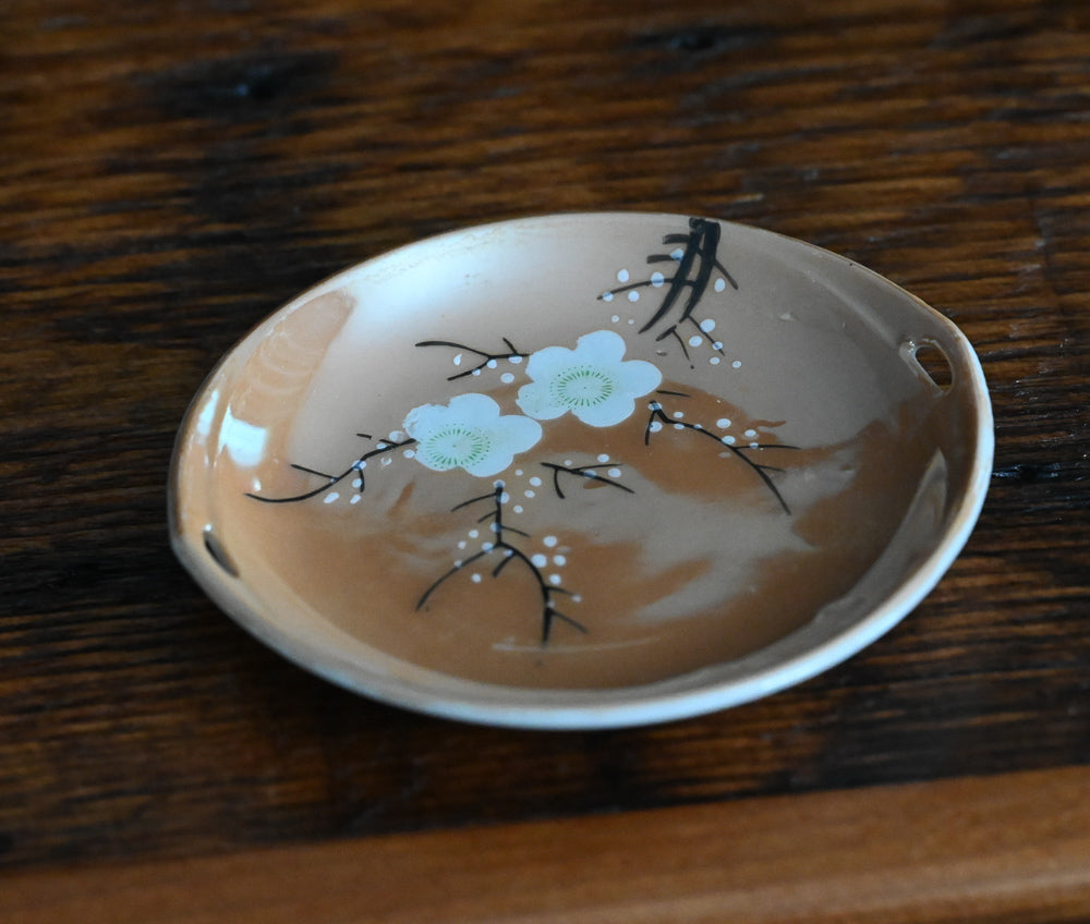 peach colored Japanese lusterware trinket dishes with white painted flowers