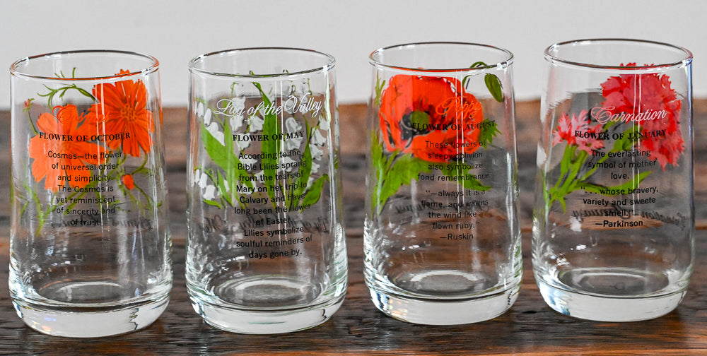 Flower of the month glasses on wooden table