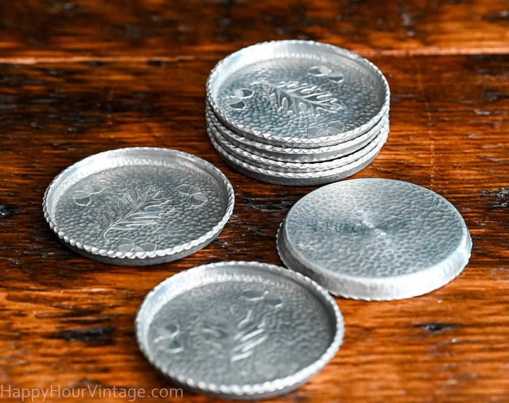 oak leaf and acorn stamped aluminum vintage coasters