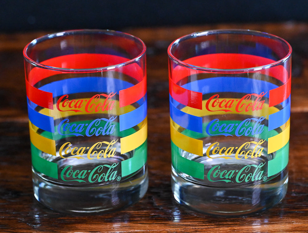 red, blue, yellow and green striped Vintage Coca-Cola double rocks glasses