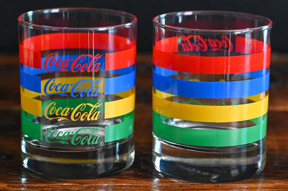 red, blue, yellow and green striped Vintage Coca-Cola double rocks glasses