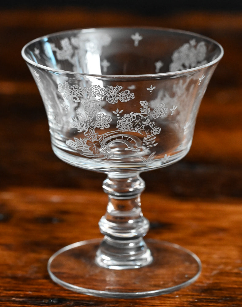 clear Fostoria Garden scene etched cocktail coupes with trees, bridges and floral