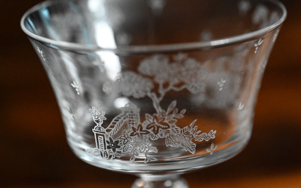 clear Fostoria Garden scene etched cocktail coupes with trees, bridges and floral