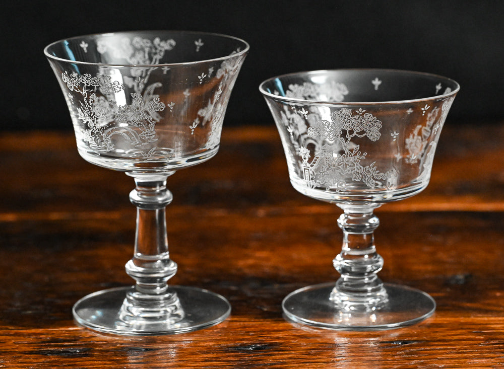 clear Fostoria Garden scene etched cocktail coupes with trees, bridges and floral