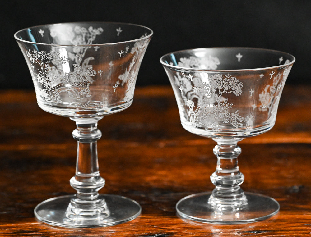 clear Fostoria Garden scene etched cocktail coupes with trees, bridges and floral