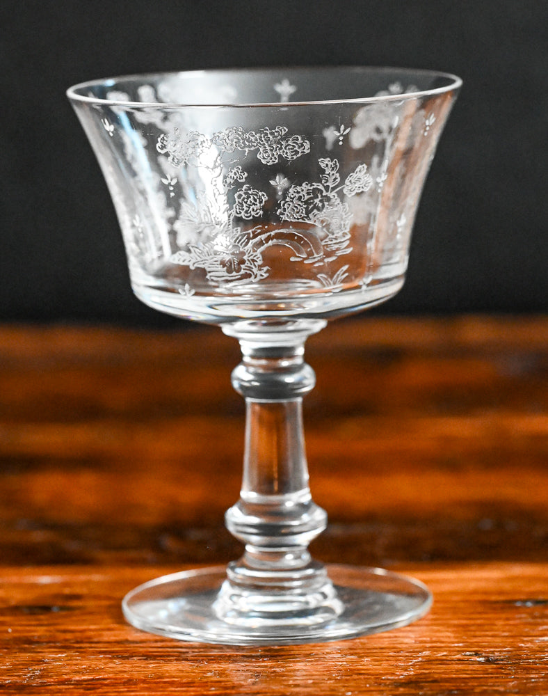 clear Fostoria Garden scene etched cocktail coupes with trees, bridges and floral