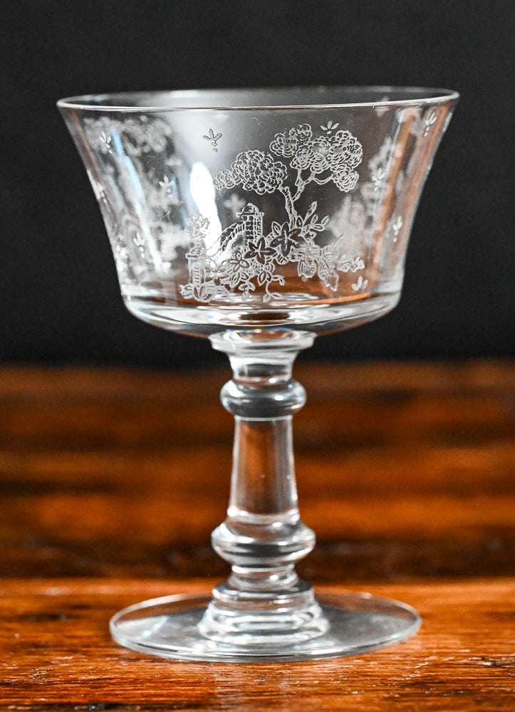 clear Fostoria Garden scene etched cocktail coupes with trees, bridges and floral