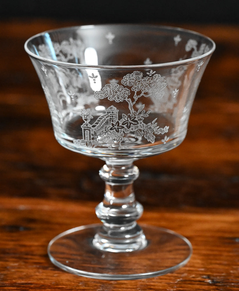 clear Fostoria Garden scene etched cocktail coupes with trees, bridges and floral