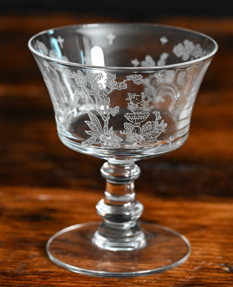 clear Fostoria Garden scene etched cocktail coupes with trees, bridges and floral