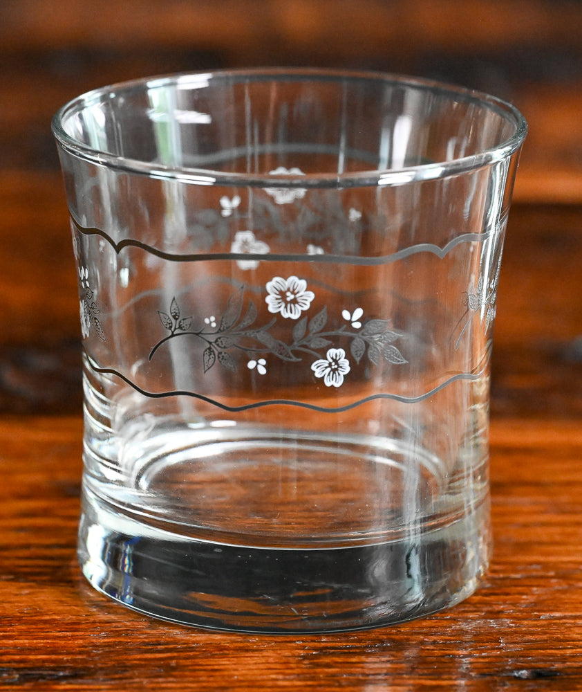 white and gray floral rocks glass