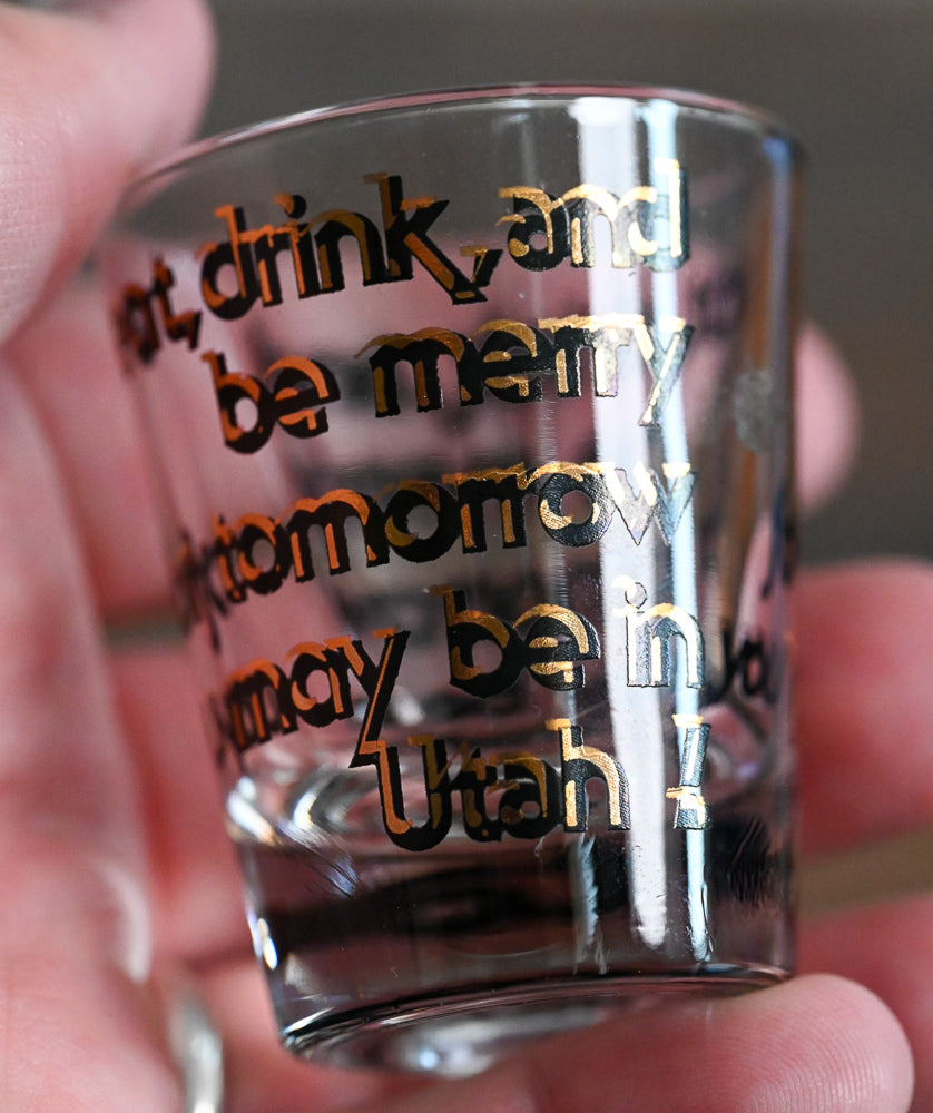 black and gold words on Utah shotglass