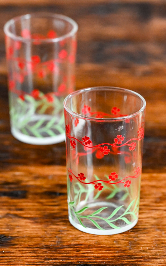 red flowers and green leaves juice glasses