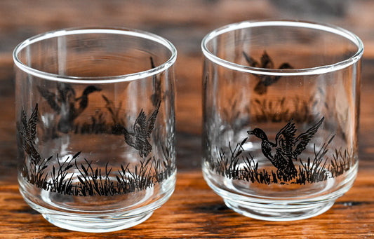 lowball glasses with ducks printed in black